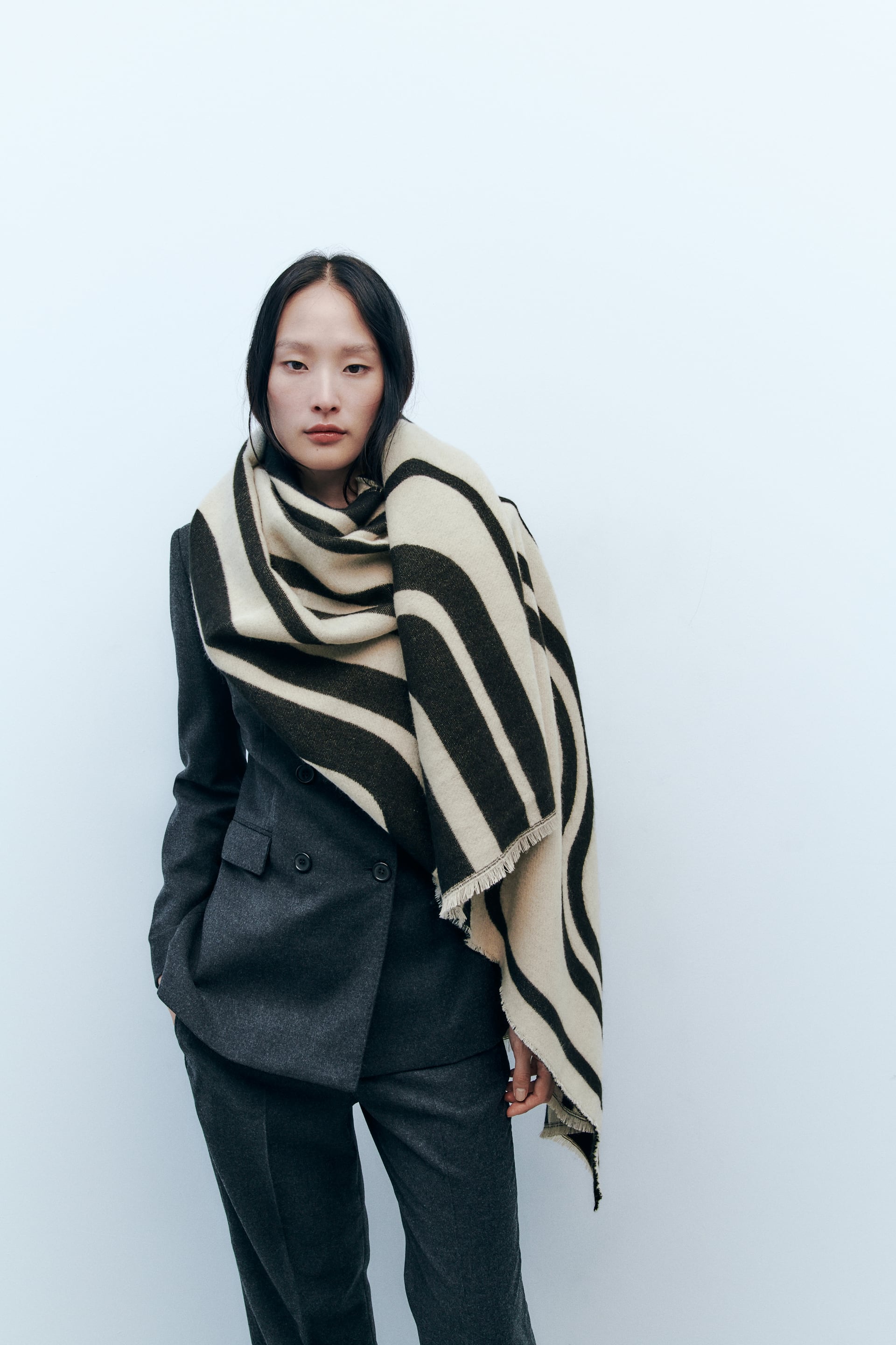 Embrace the Elegance: The Art of Combining a Windbreaker and Scarf for an Unforgettable Style