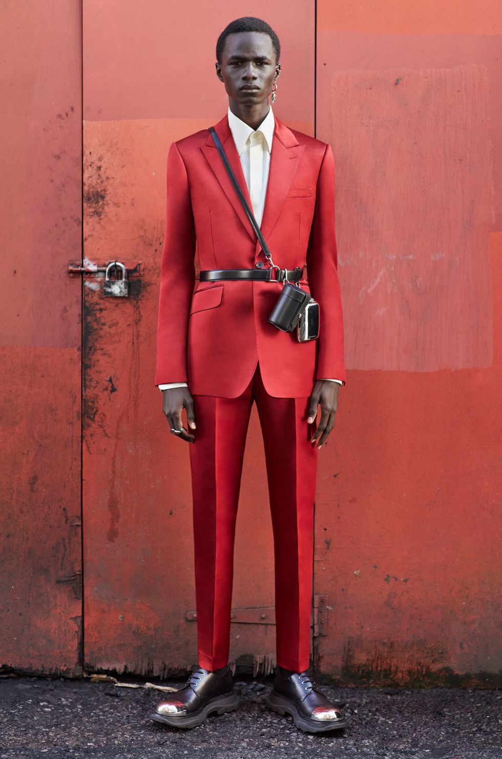 Title: The Red Suit: A Tale of Power, Confidence, and Style