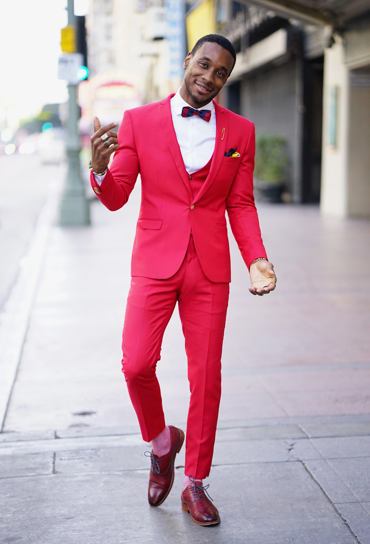 Title: The Red Suit: A Tale of Power, Confidence, and Style