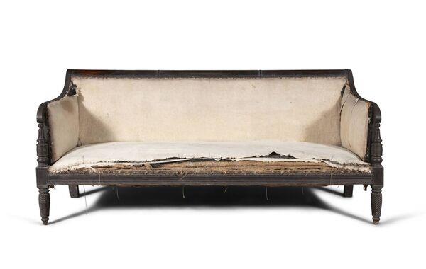 Title: The Resilient Legacy of an Antique Sofa