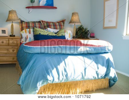 A Cool and Calming Bedroom with Blue Curtains