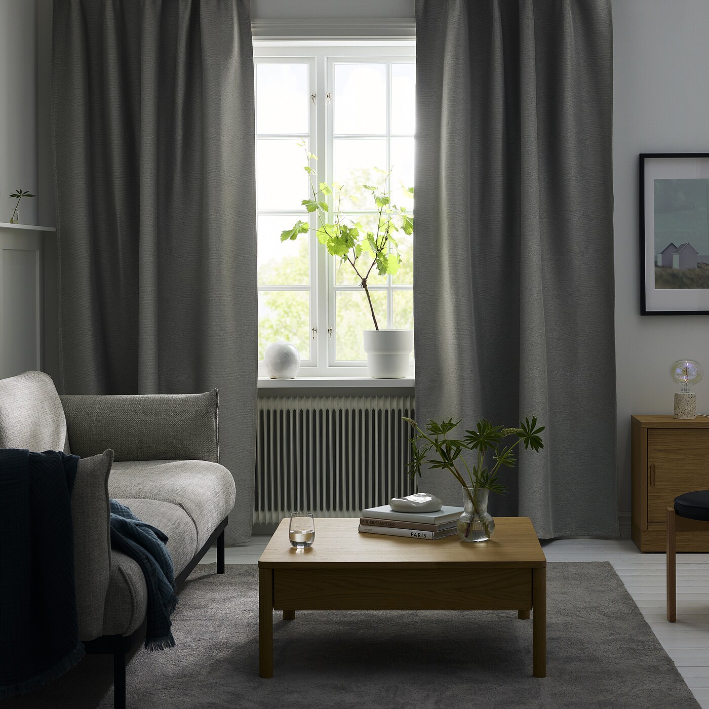 The perfect combination of light gray walls and curtains in the living room